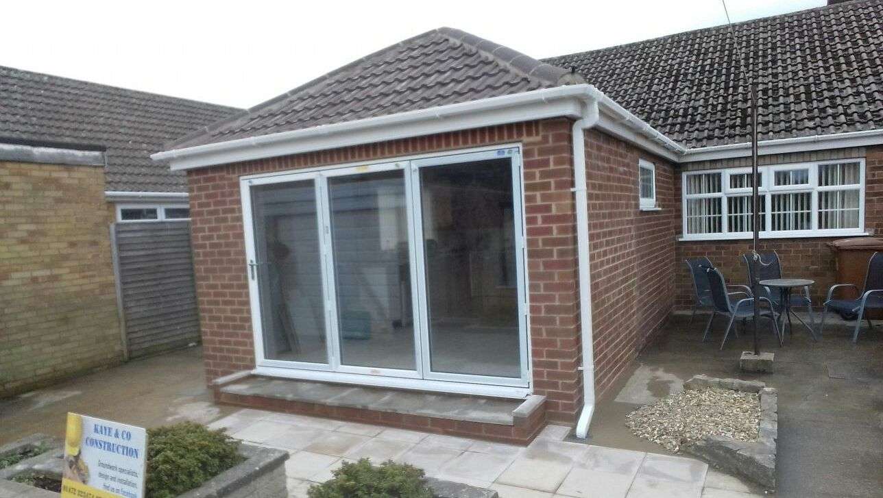 High-quality brickwork extension with sliding patio doors built by Kaye & Co Construction in Grimsby.